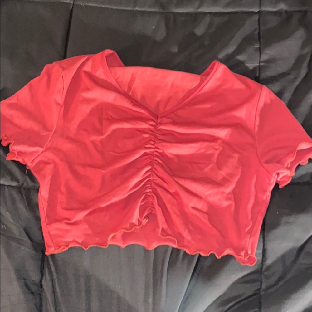 A Red Cropped short sleeved shirt